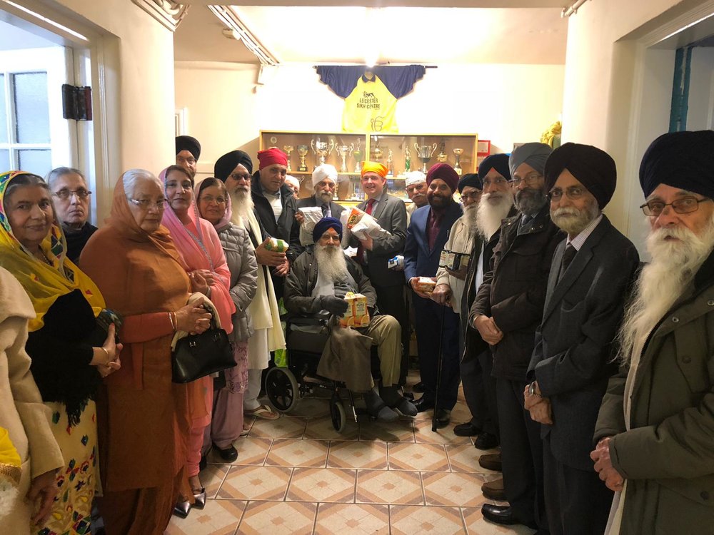 Jon Ashworth, along with Councillor Gugnani, accepts the generous donation to the Highfields Food Bank from Guru Amar Das Gurdwara - Friday November 23 2018