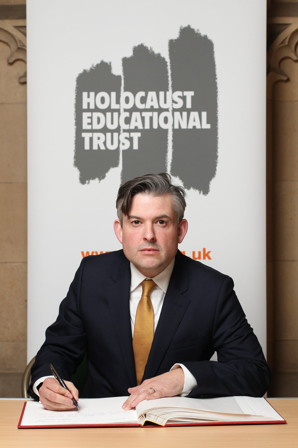 Jon signs the Holocaust Memorial Book of Commitment honouring those who were murdered during the Holocaust and paying tribute to the Holocaust survivors - Wednesday January 23 2019