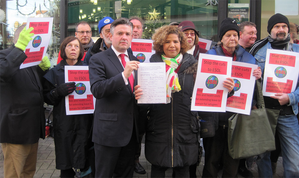 Jon being presented with the petition by Malka Al-Haddad from Leicester Civil Rights Movement