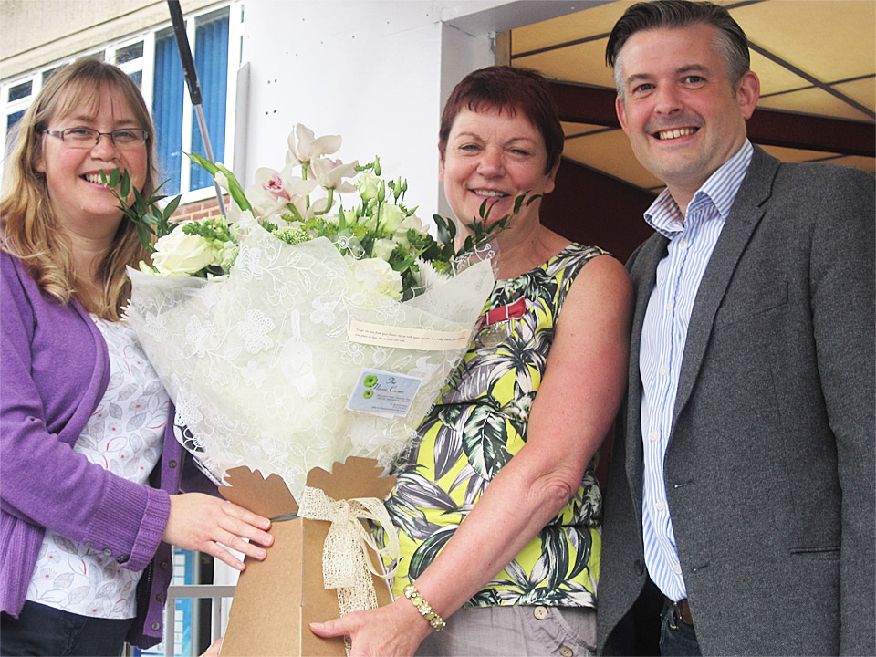 Jon presenting Janet (centre) her bouquet of flowers