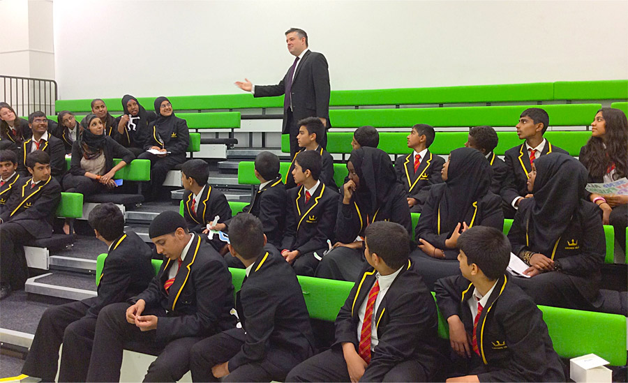 Jon demonstrating how Parliamentary debates work and describing the role of an MP