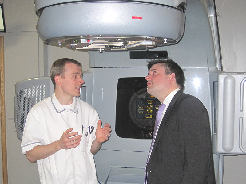 Jon with Dan Freeman (Superintendant Radiographer) at the Linear Accelerator that is used to treat cancer