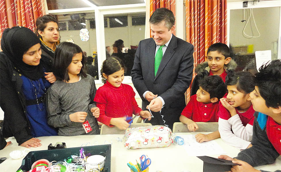Jon wrapping presents with Moonwalkers Youth Group children