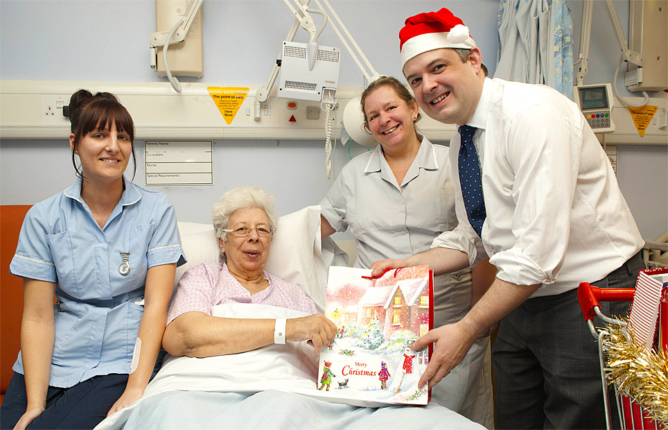 Jon presents a gift to Doris Murray, along with (left to right) Jessica Smith and Tracy Bolton.