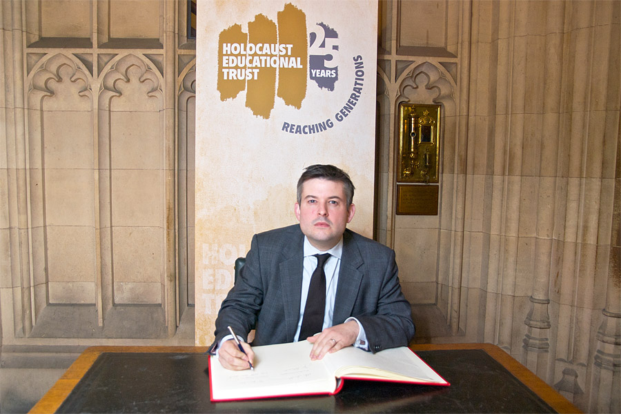 Photo of Jon signing the Book of Commitment