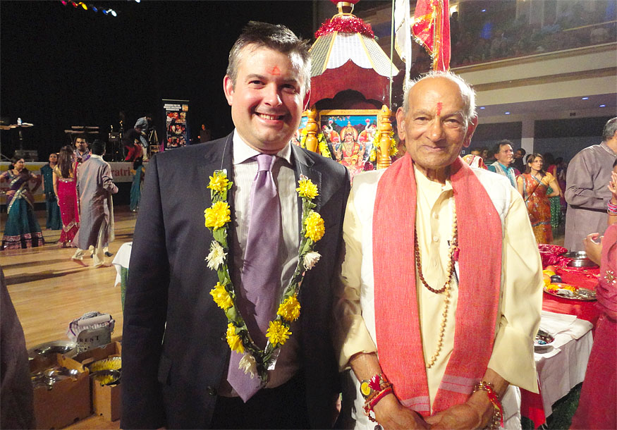 Jon with the priest at the De Montfort Hall celebrations