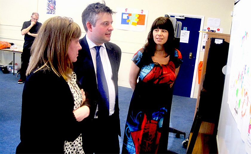 Jon listens to Karen’s achievements with Paula North (right), one of the Directors of Phoenix Therapies